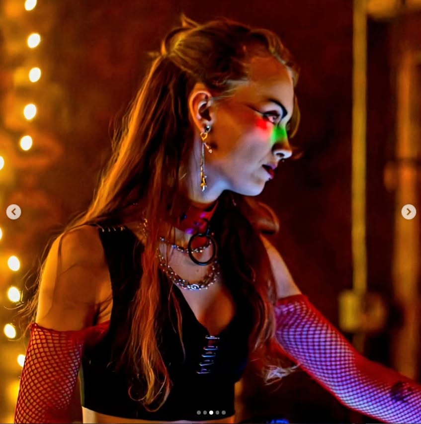 Belladonna (Ren), DJ at Asylum Windsor, performing under colorful stage lighting