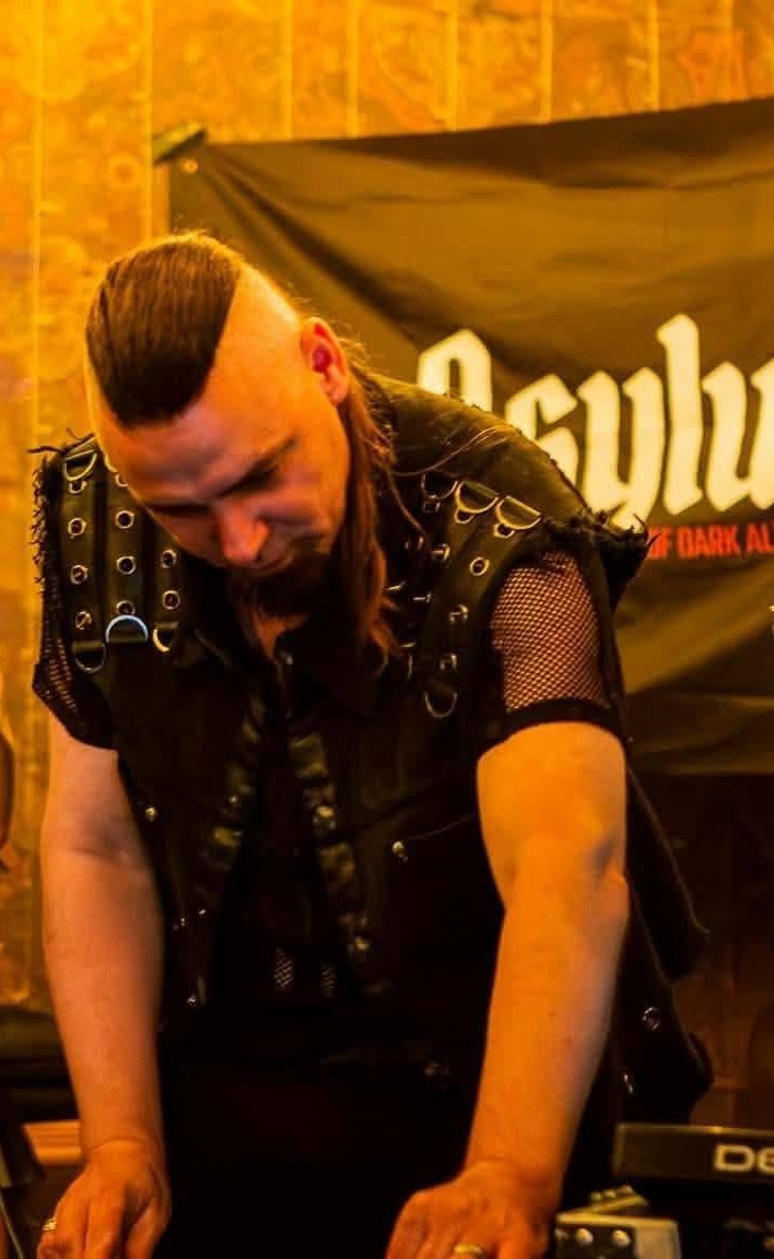 Raev, Co-Founder and Artistic Director of Asylum Windsor, DJing at an event